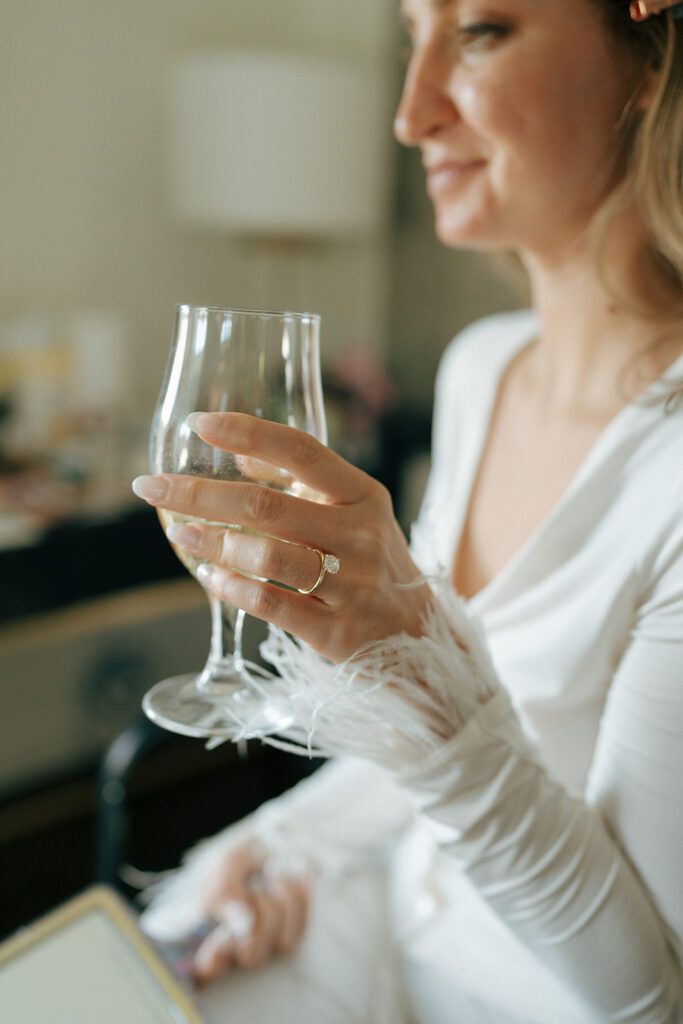 bride drinking champagne before her ceremony