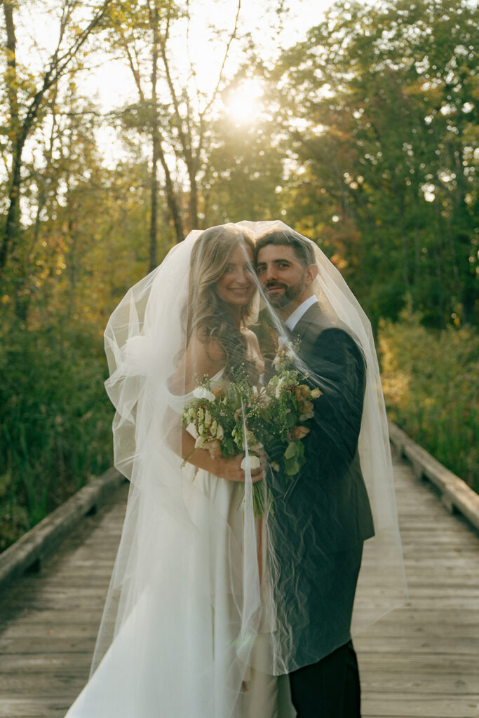 bride and groom looking at the camera