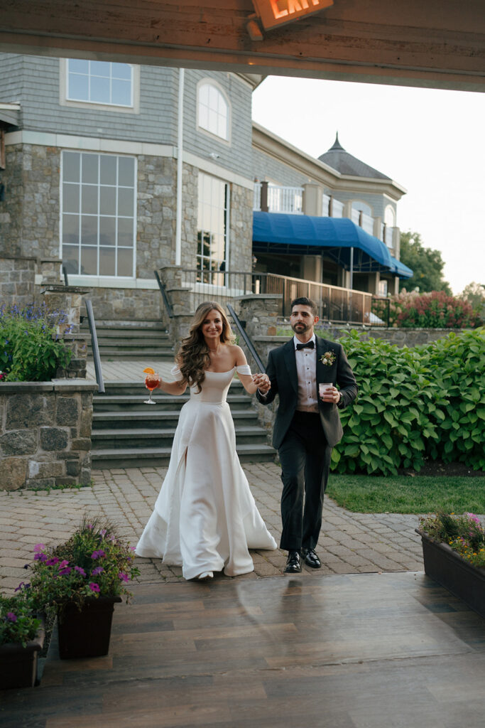 bride and groom entering their wedding reception