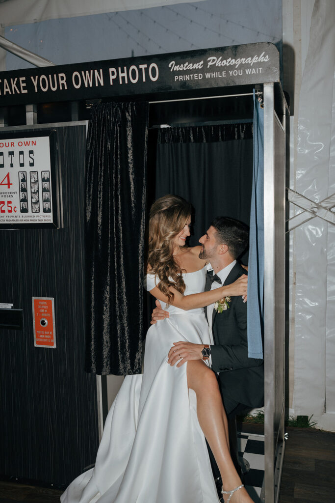 bride and groom at a photobooth