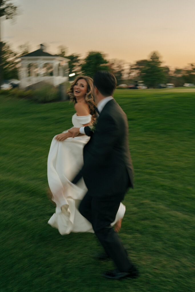 bride and groom running around their wedding reception