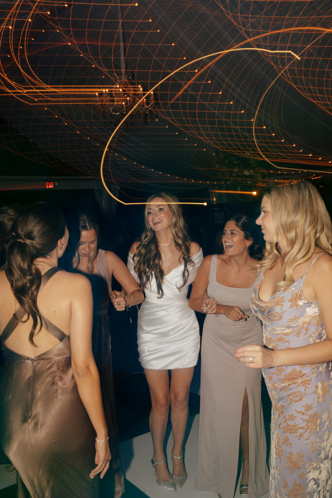 bride and her friends dancing