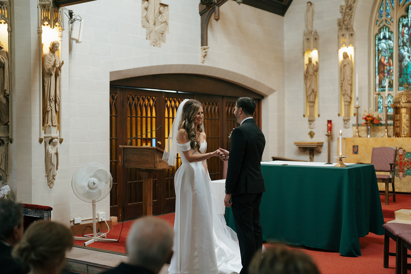 cute couple holding hands during their ceremony