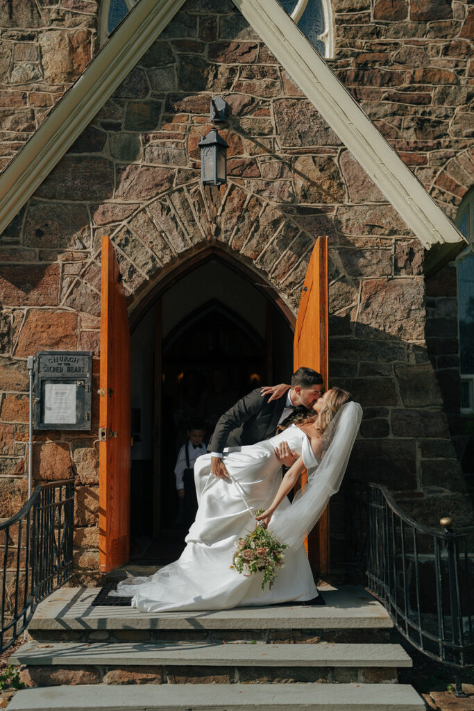 bride and groom kissing after their ceremony