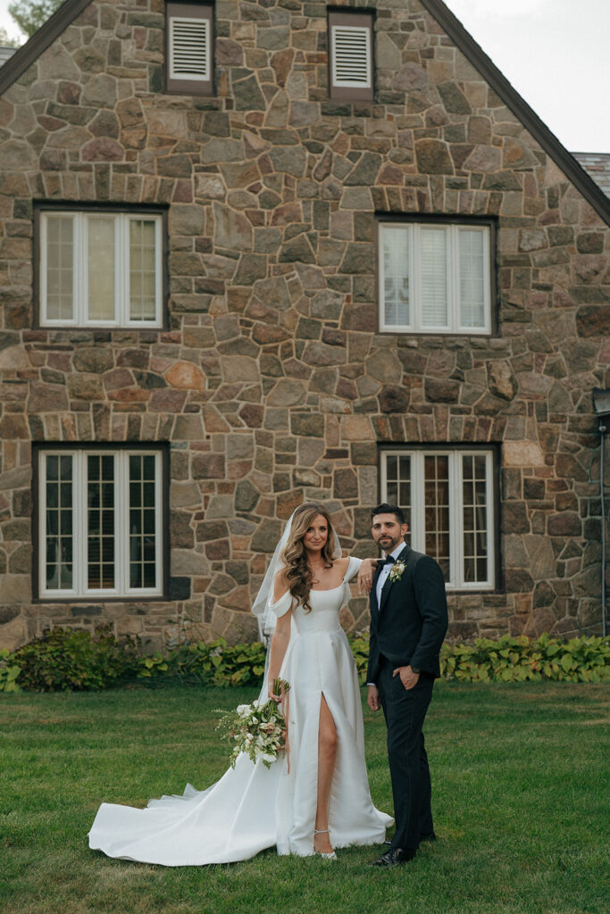 bride and groom posing for the camera