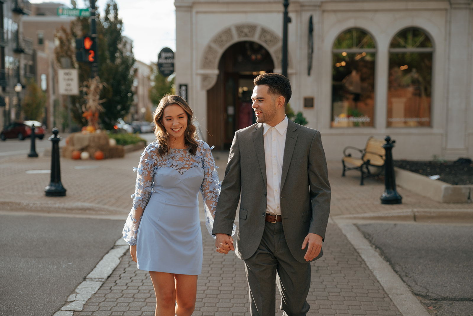 cute couple walking around downtown holland, MI