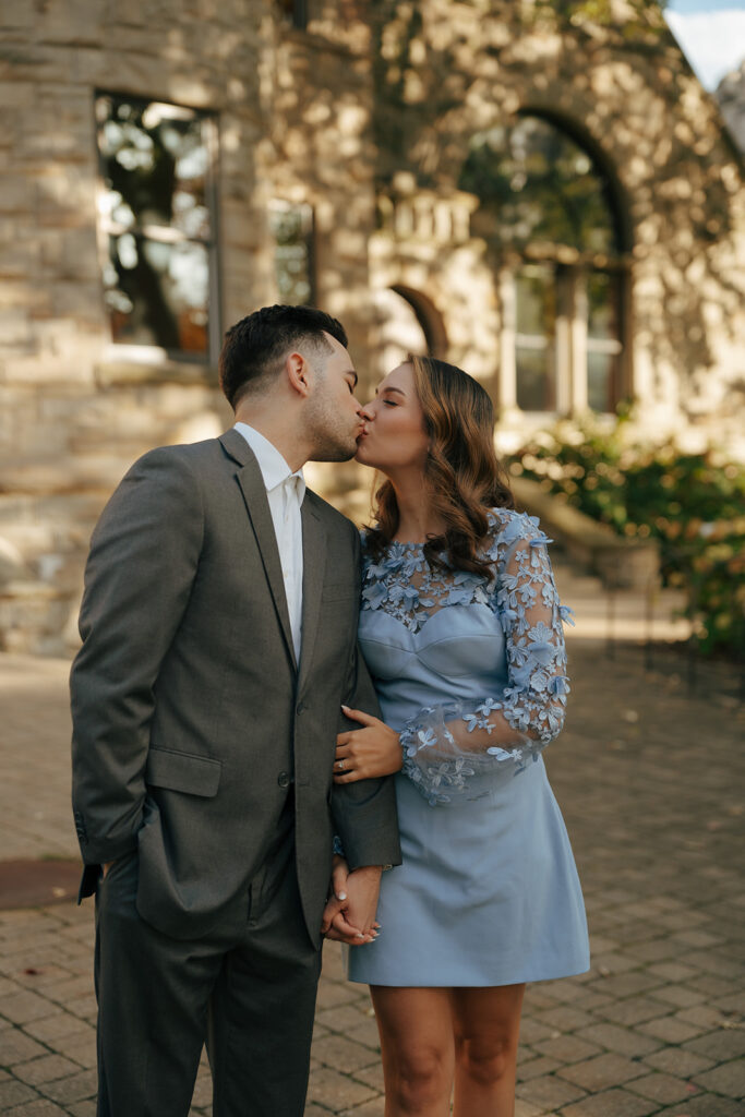 cute newly engaged couple kissing