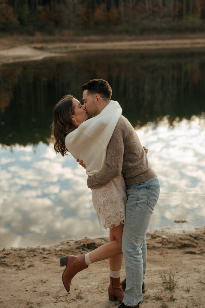 portrait of the newly engaged couple kissing