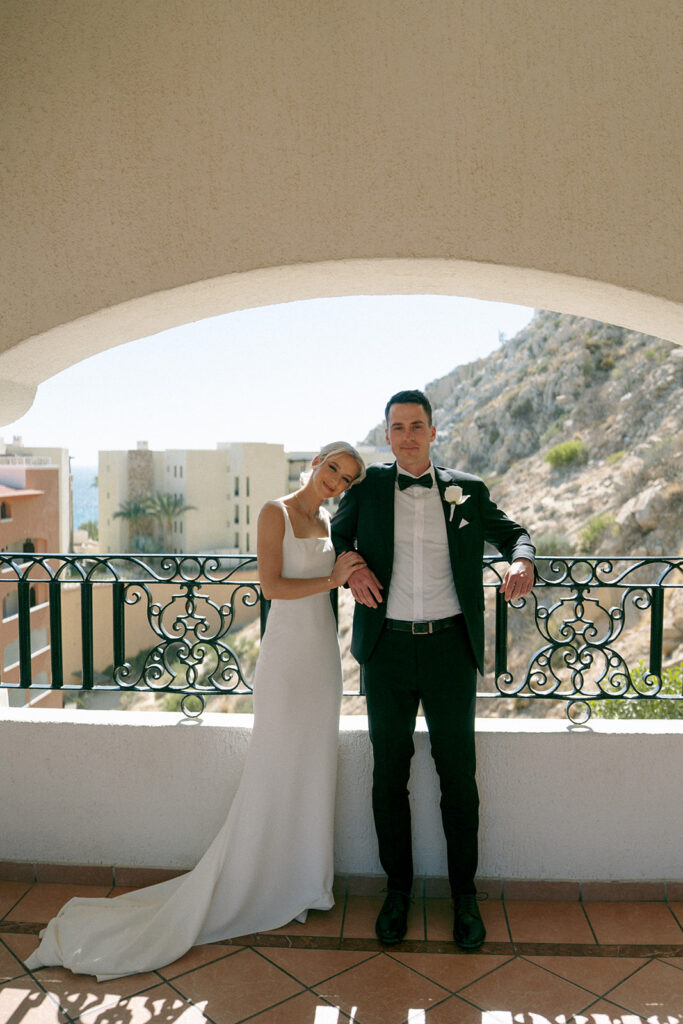 cute picture of the newlyweds looking at the camera during their session