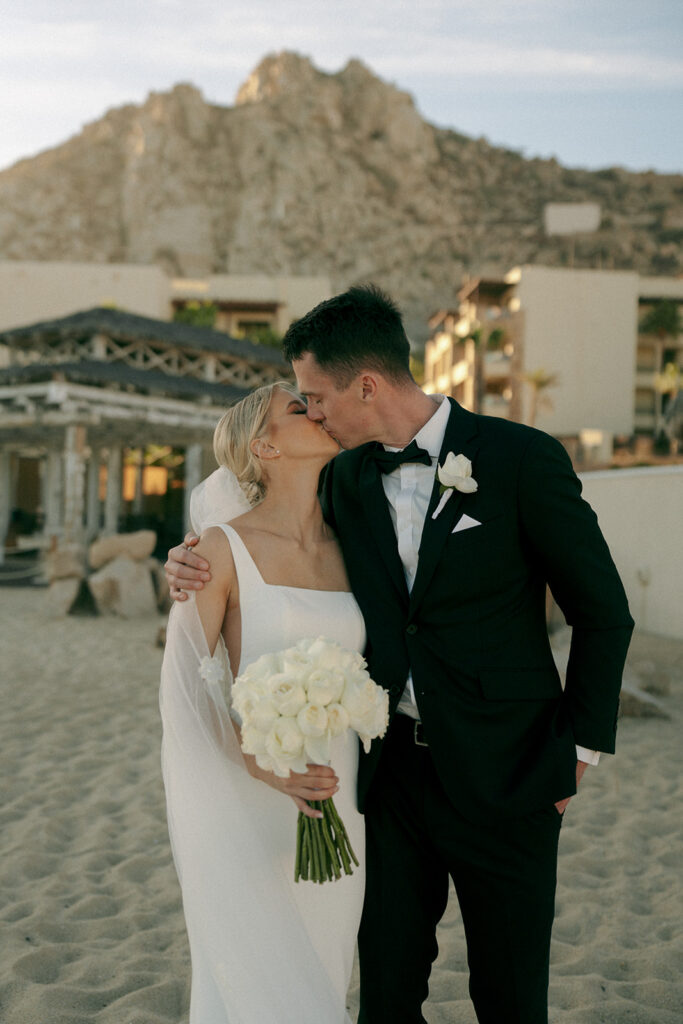 bride and groom kissing during their bridal portraits