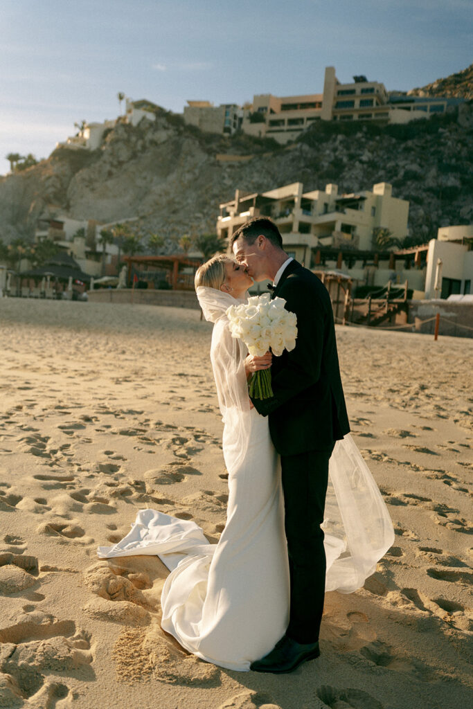 cute couple kissing during their dream bridal portraits in mexico