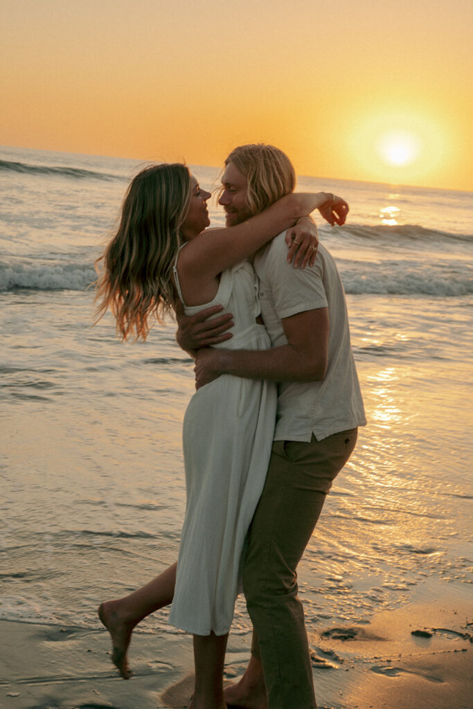 cute couple laughing with each other during their photoshoot