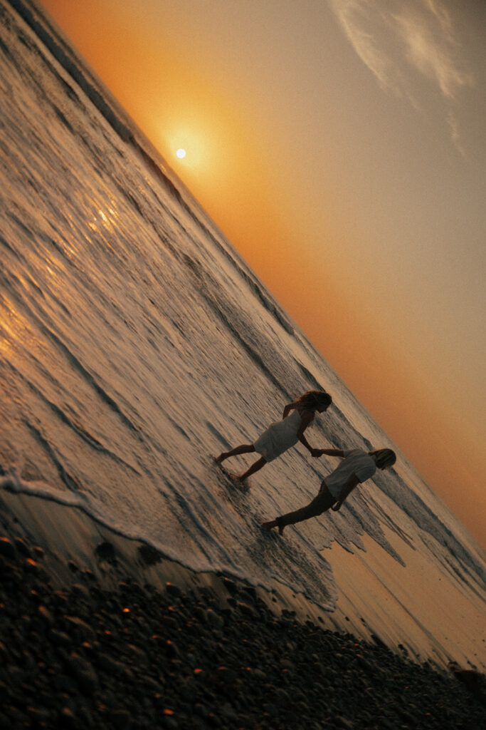 couple walking around the beach during their dream photo session