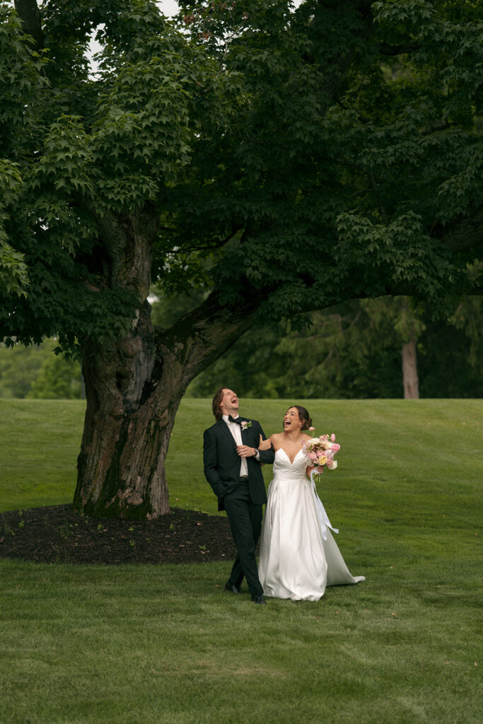 beautiful portrait of the bride and groom laughing with each other