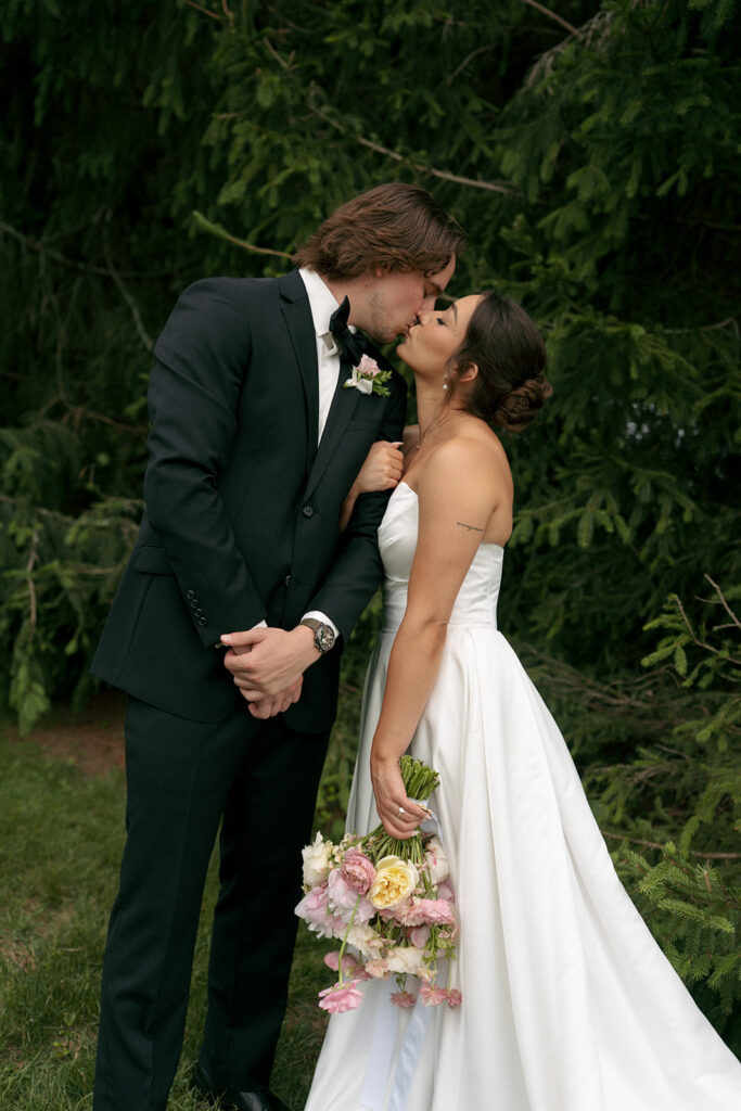 portrait of the newlyweds kissing