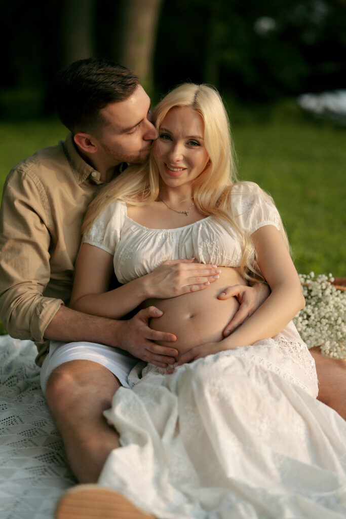 husband kissing his wife on the cheek