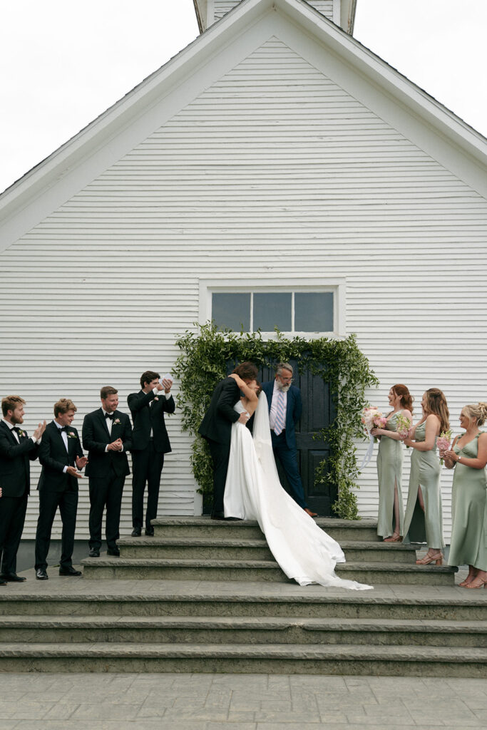 bride and groom kissing after their ceremony