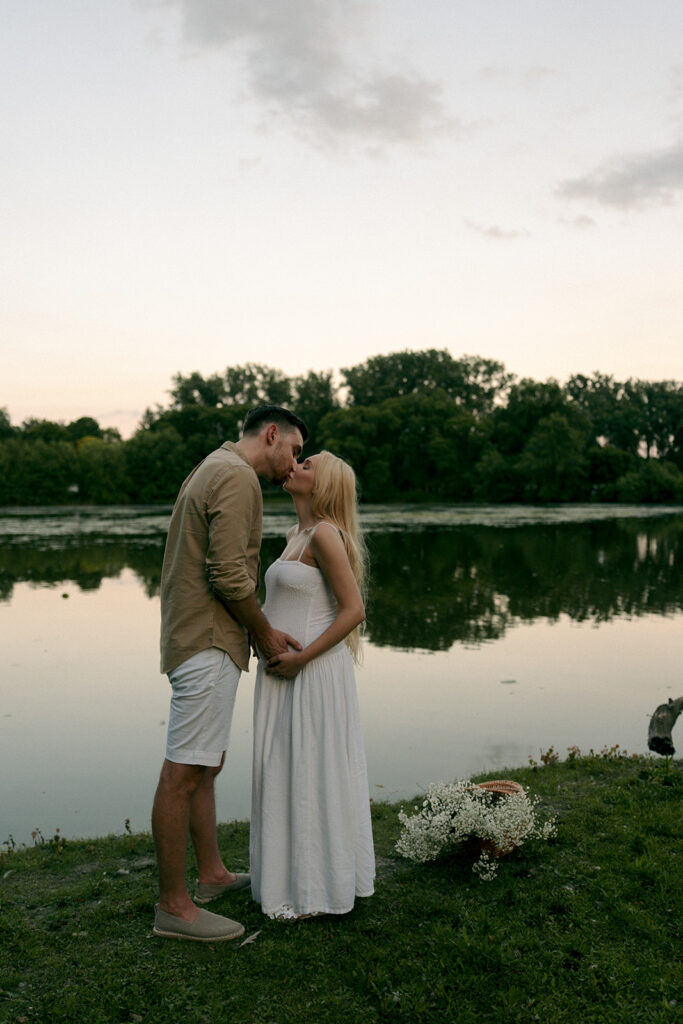 cute picture of the soon to be parents kissing