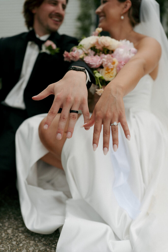 cute couple showing their wedding rings