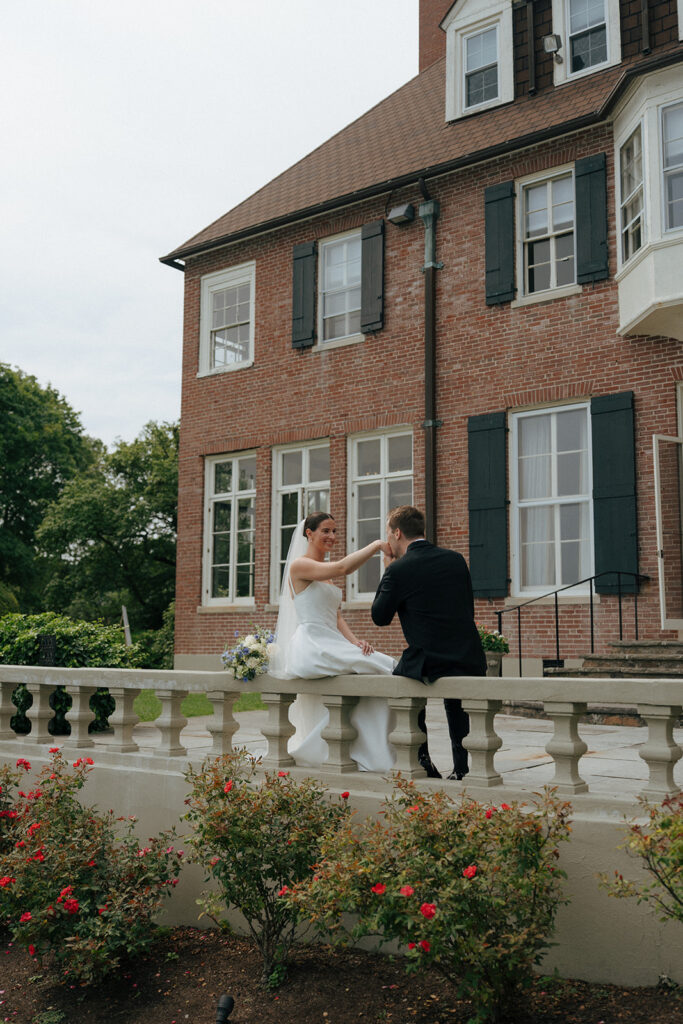 groom kissing the brides hand