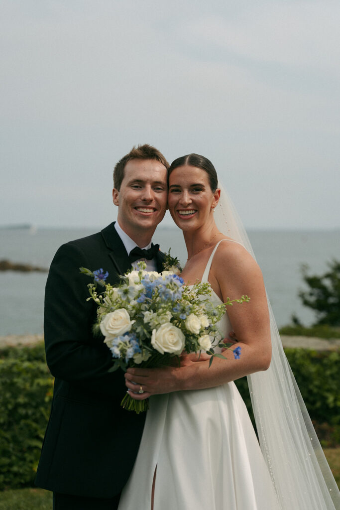 Bride and groom, smiling at the camera during their bridal portraits