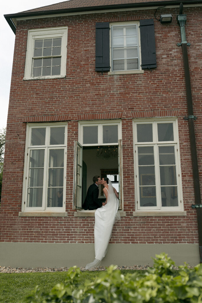 Cute picture of the bride and groom kissing