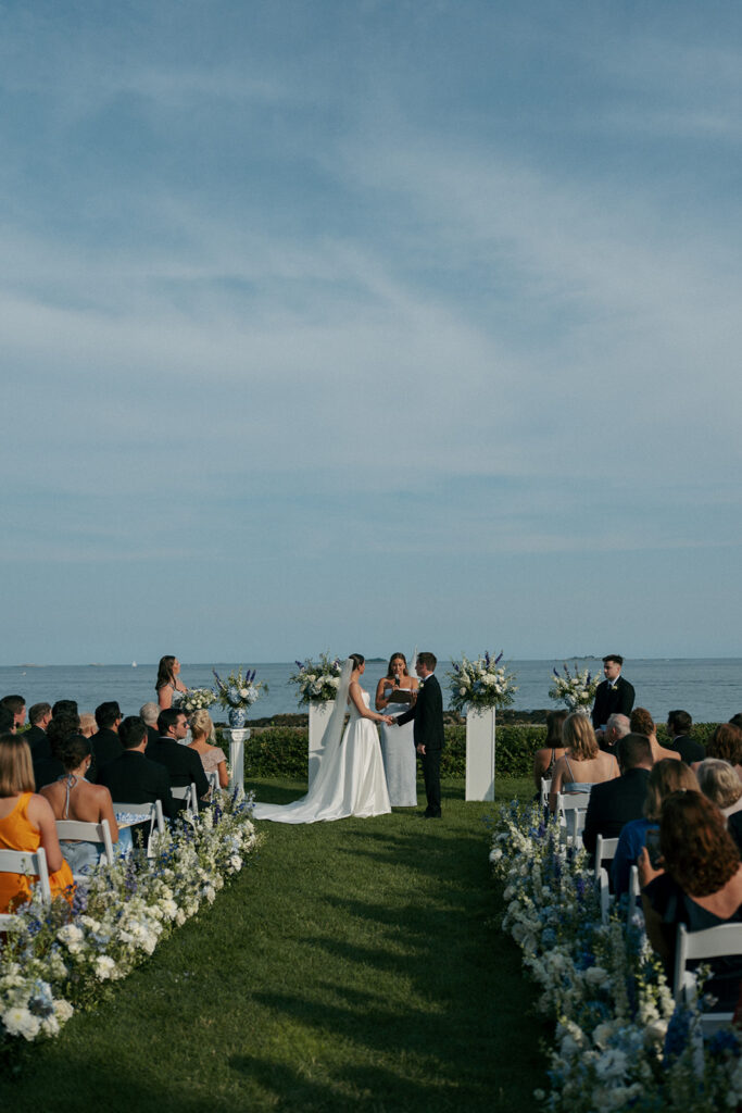 Bride and groom holding hands during their ceremony