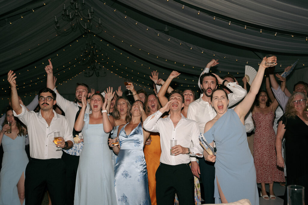 Wedding guests dancing at the reception party