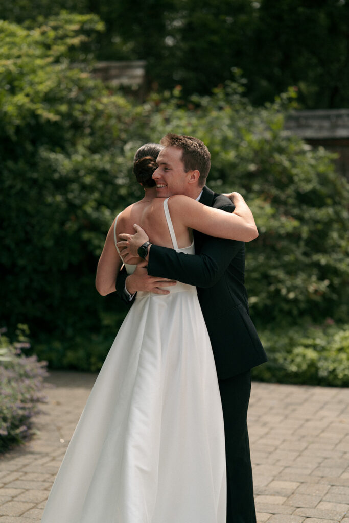 Bride and groom, hugging after their first look