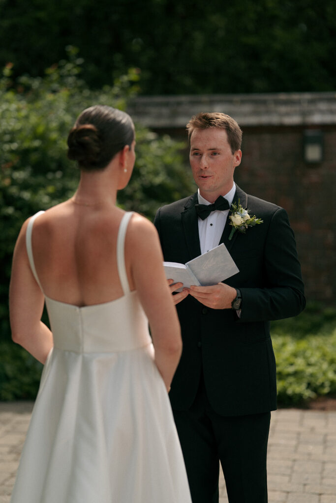 Couple emotional reading their vows