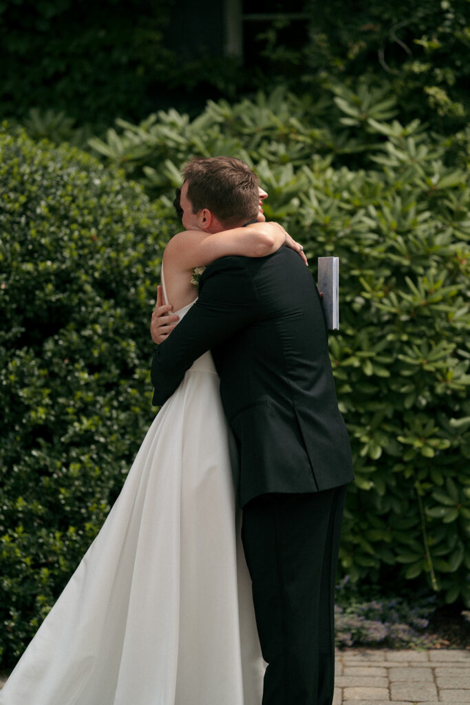 Bride and groom, hugging before heading to their ceremony