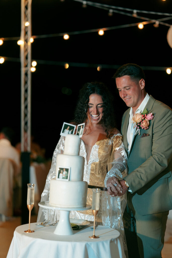 bride and groom cutting their wedding cake