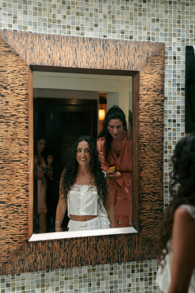 bride doing her makeup before the ceremony