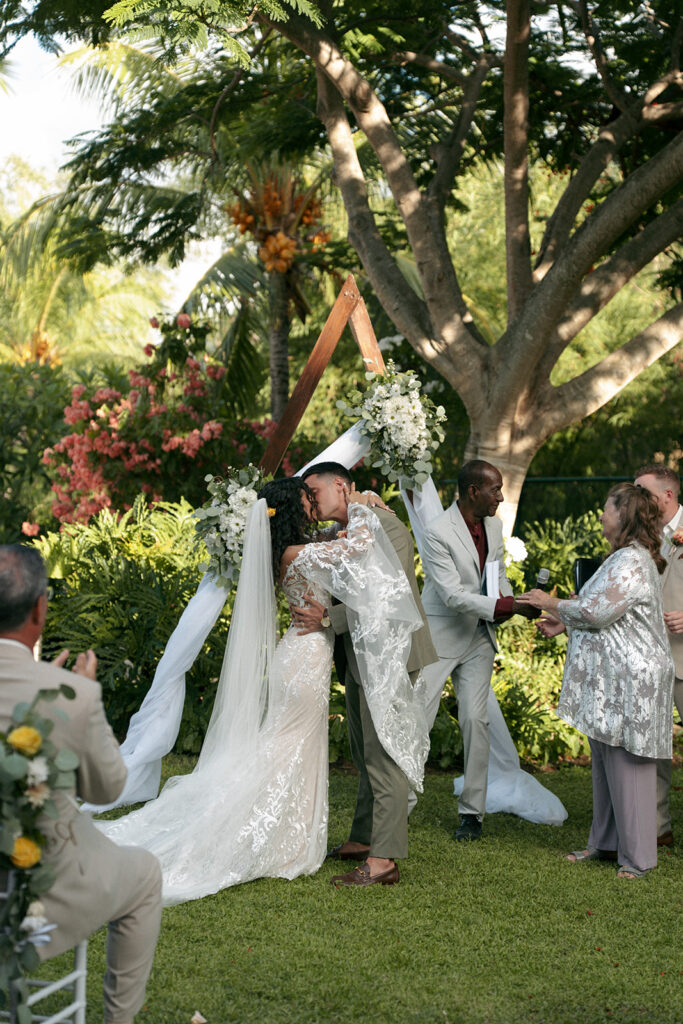 bride and groom kissing after their ceremony
