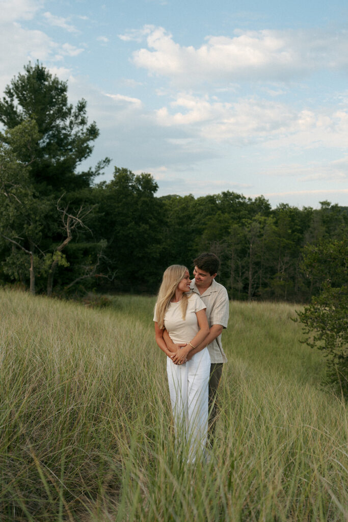 couple smiling at each other during their photoshoot
