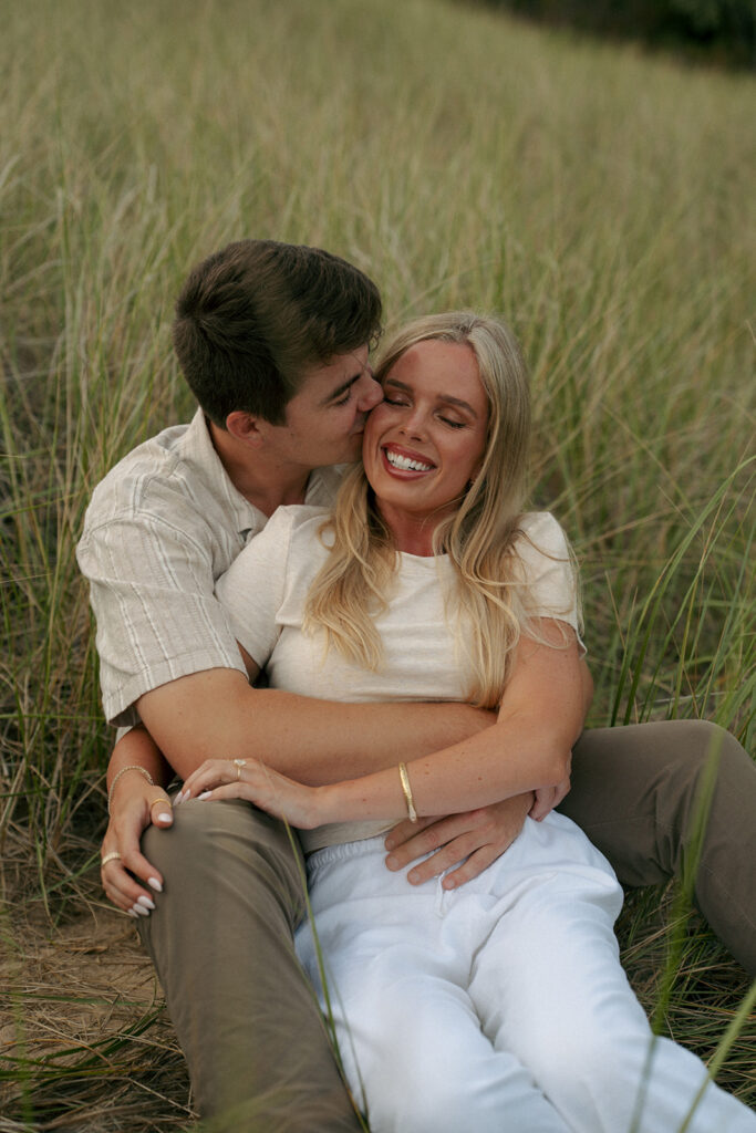 fiance kissing his fiance on the cheek