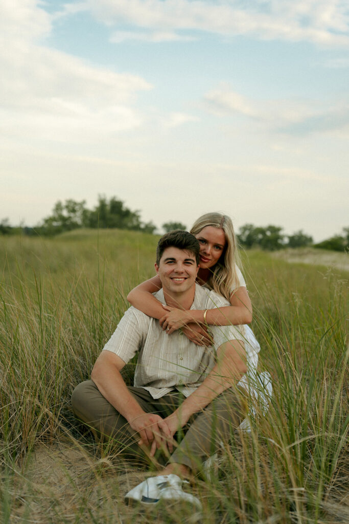 couple smiling at the camera during their photoshoto