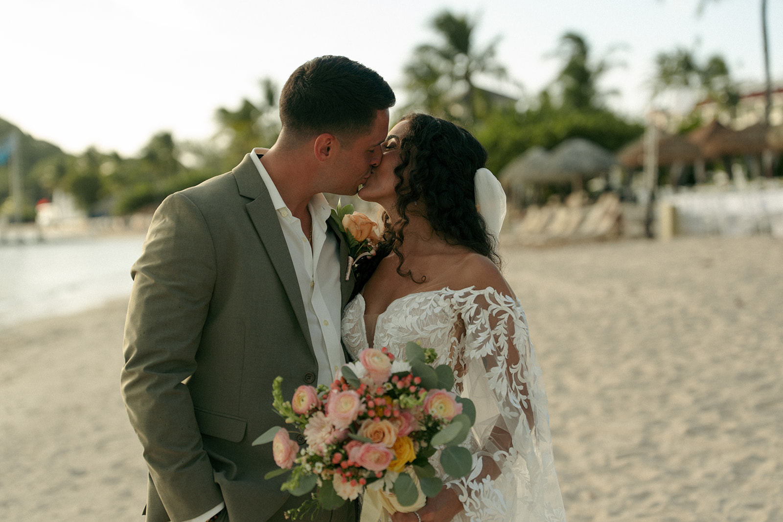 portrait of the newlyweds kissing