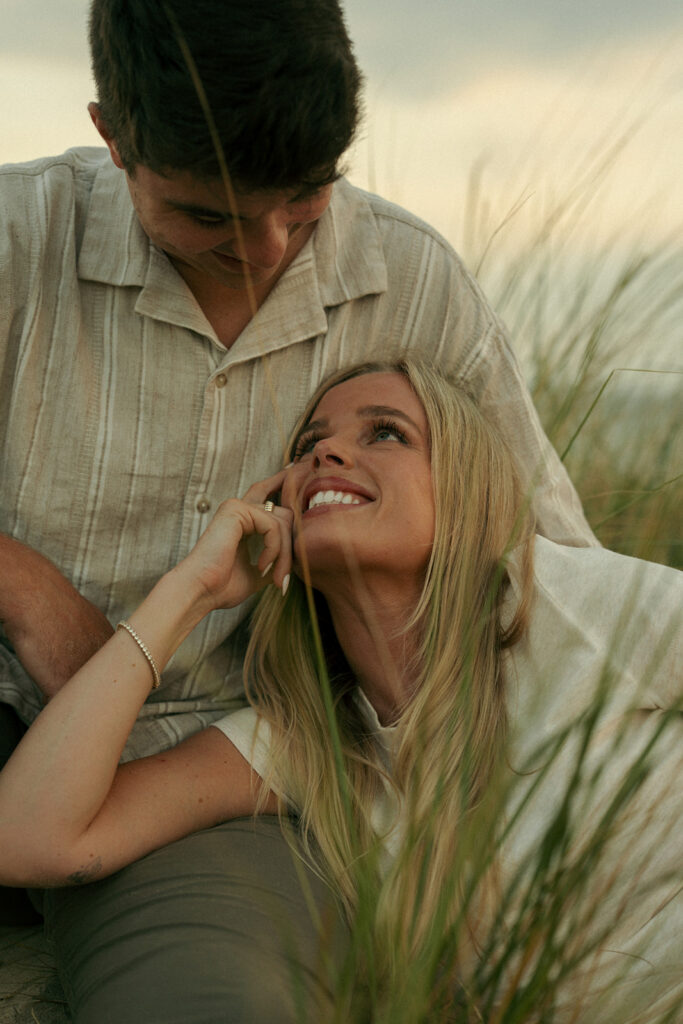couple smiling at each other during their photoshoot