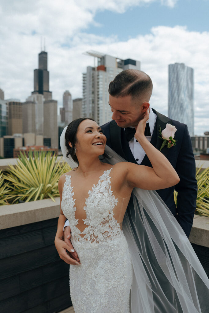 Portrait of the bride and groom, smiling at each other