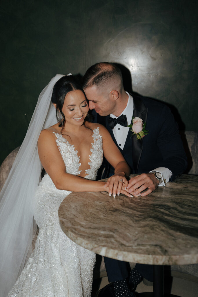 Groom, kissing the bride on the cheek
