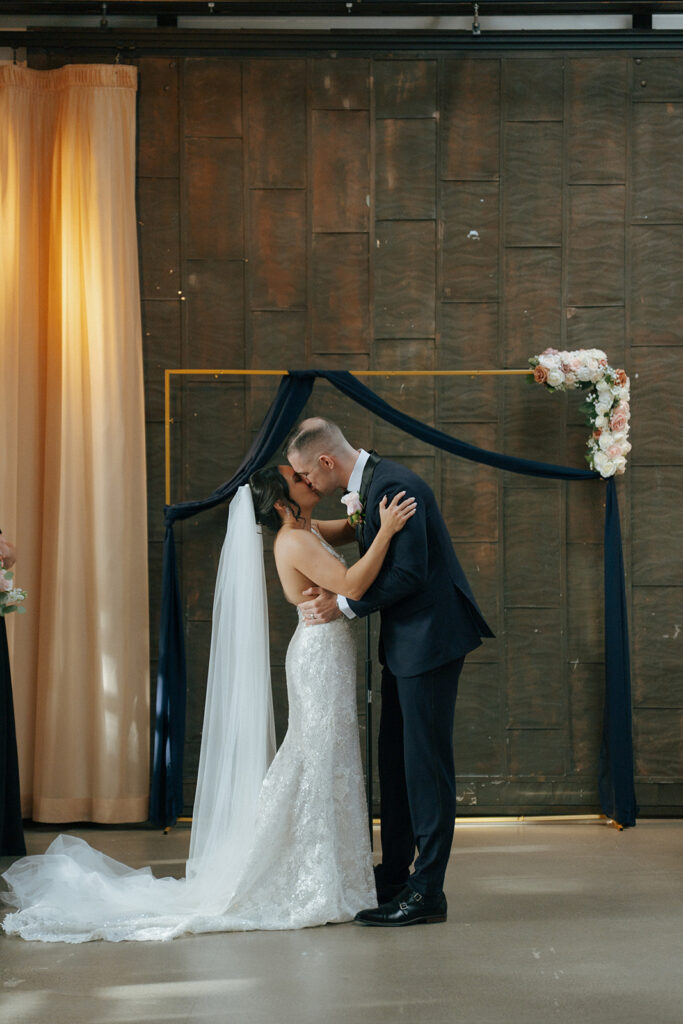 Couple kissing after their wedding ceremony