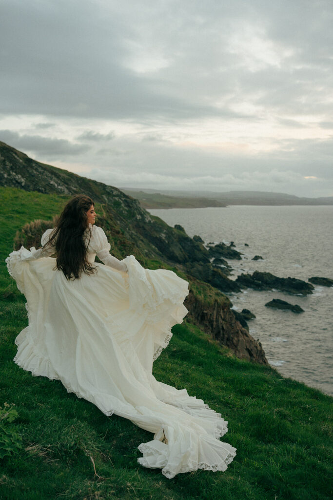 Intimate ceremony moment on cliffs elopement photos Fast Castle Edinburgh Scotland with ocean views