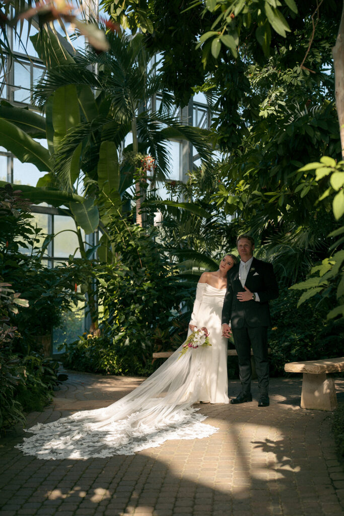 Bride and groom sunset portraits in botanical garden at Fredrick Meijer Gardens Grand Rapids