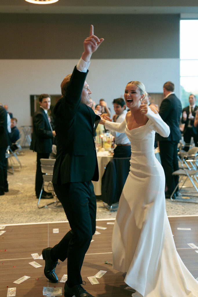 Wedding guests celebrating during reception at Fredrick Meijer Gardens venue