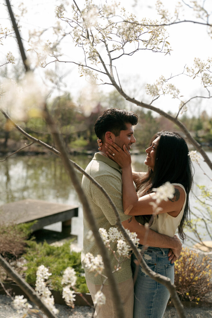 Engaged couple embracing at Fredrick Meijer Gardens Grand Rapids Michigan