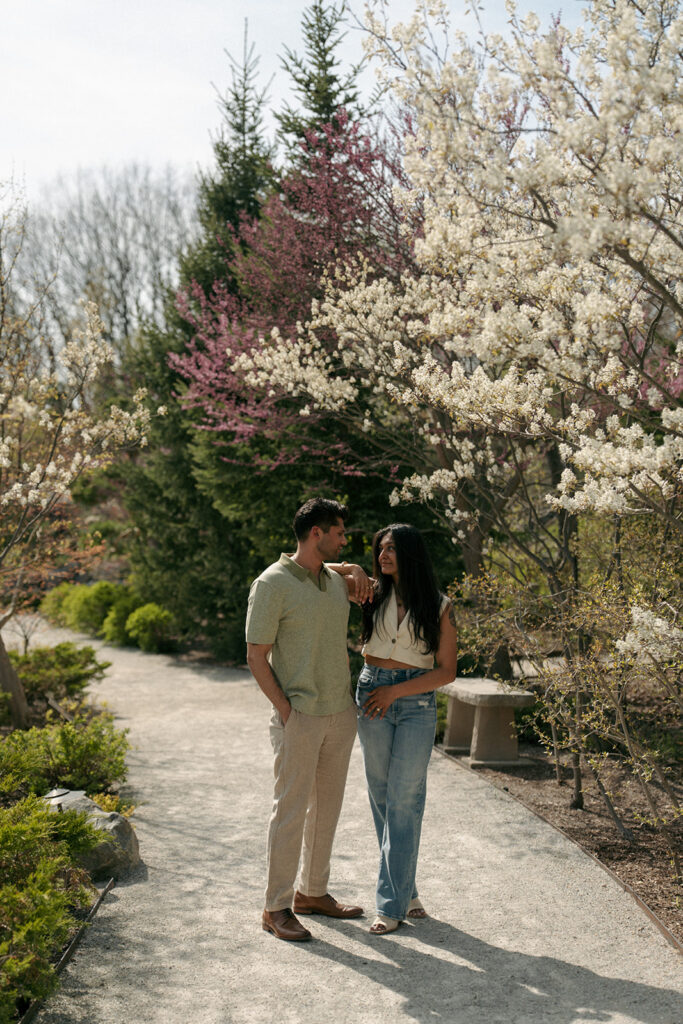 Candid laughing moment between couple at Frederik Meijer Gardens Grand Rapids Michigan