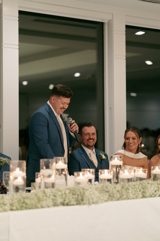 Newlyweds kissing in getaway car at end of Wabeek Club wedding
