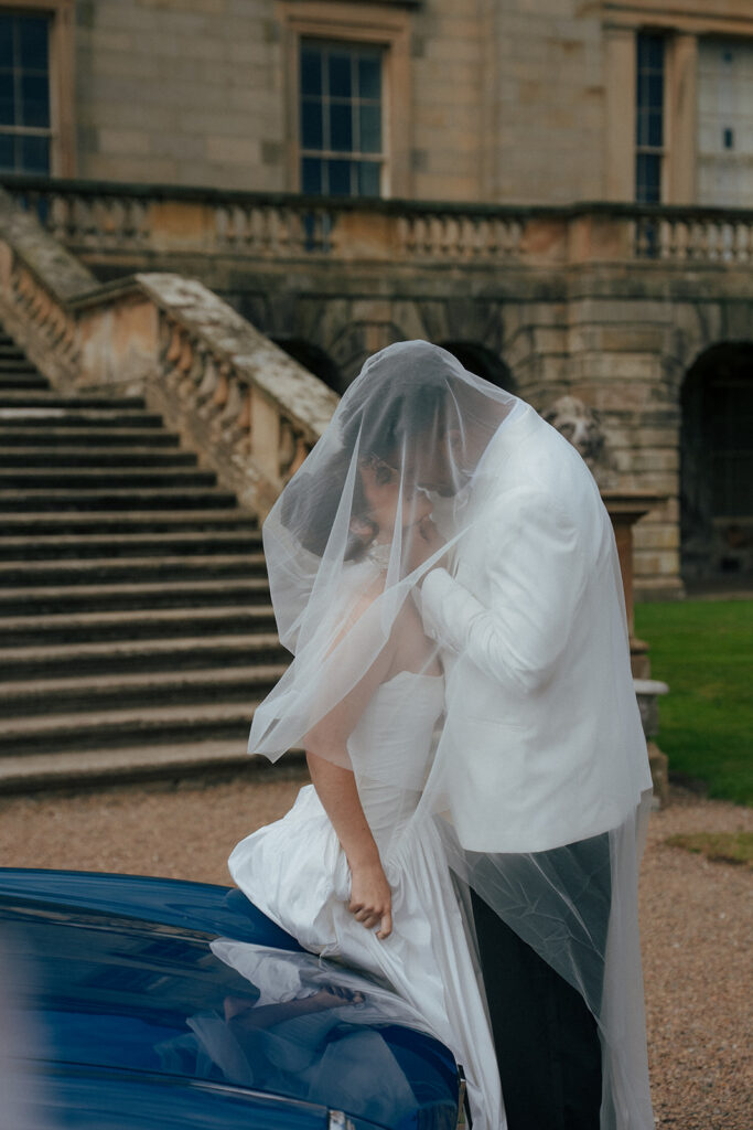 Romantic couple portrait on grand staircase at Gosford House wedding
