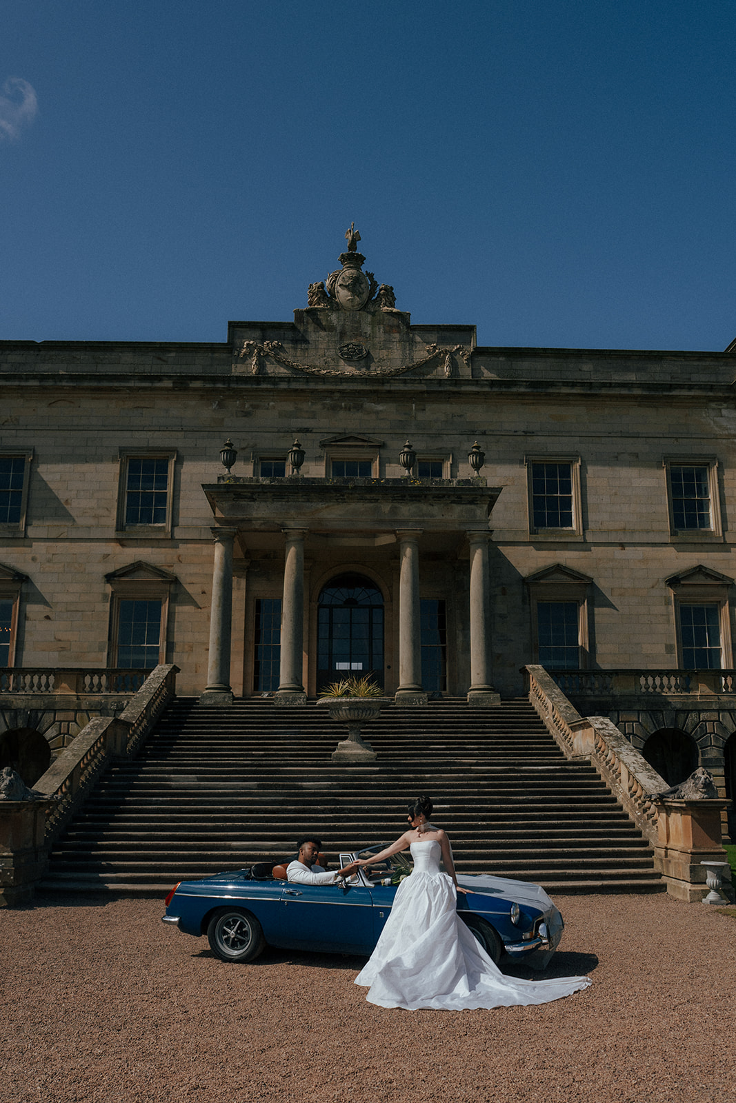 Bride in elegant lace gown at historic Gosford House Scotland wedding